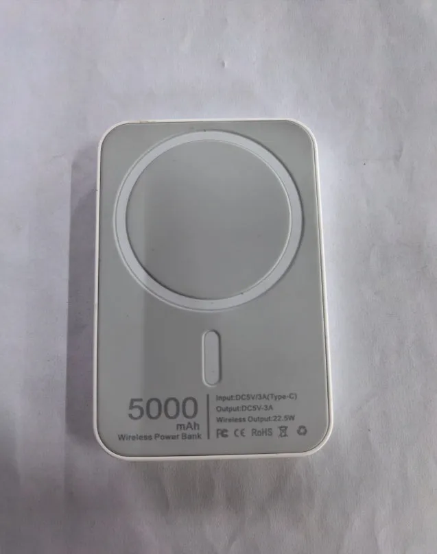 White magnetic wireless charger power bank with 5000mAh capacity measuring 100x65mm