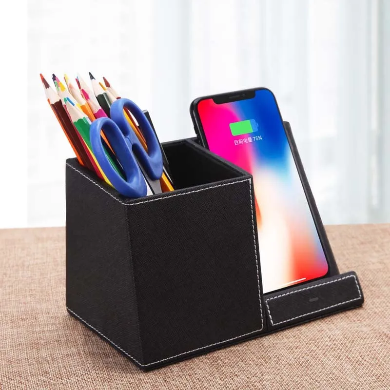 Black leather pen holder wireless charging station for desk organisation with phone charging surface