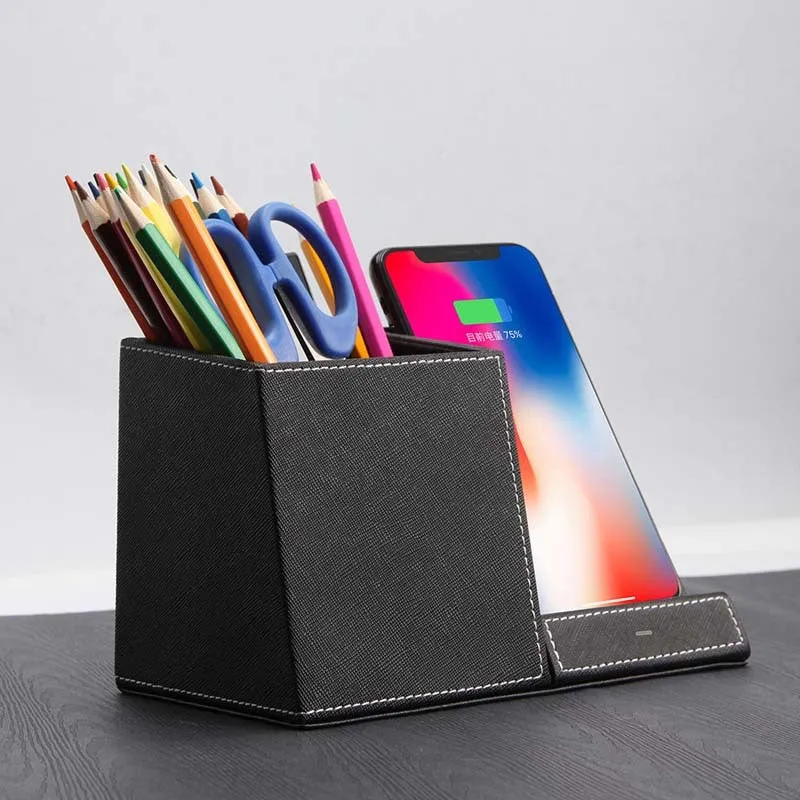 Black leather pen holder wireless charging station for desk organisation with phone charging surface