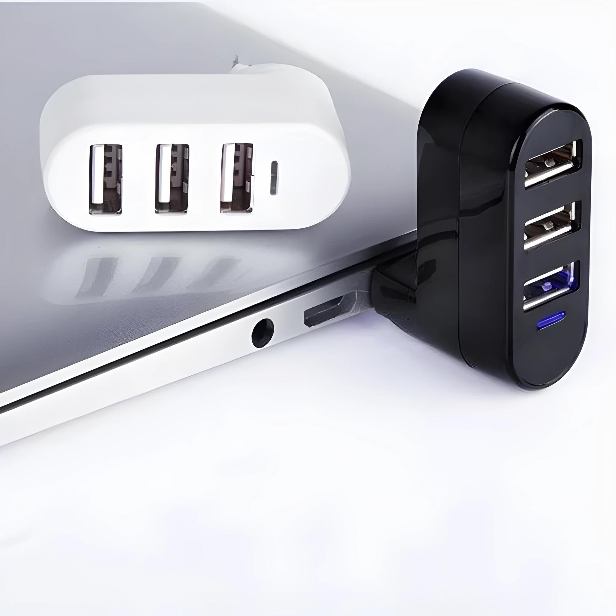 A black and a white USB 2.0 hub splitter with multiple ports.