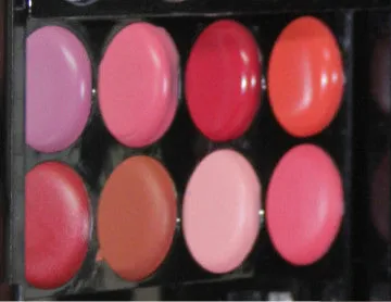 Three-layer makeup box with 24 colour eyeshadows, 8 lipsticks, blushes, powders, brushes, and mirror