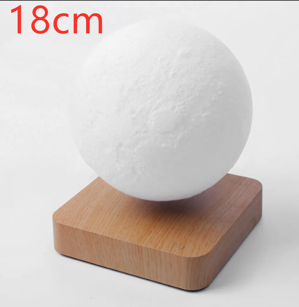 Magnetic levitation moon night light with 14cm 3D-printed planet suspended above a dark peach wood base