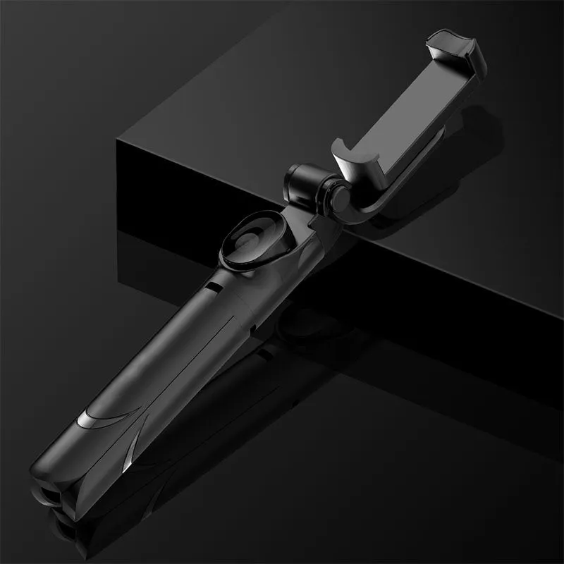Bluetooth handheld selfie stick with wireless remote control in black and white, folded for portability