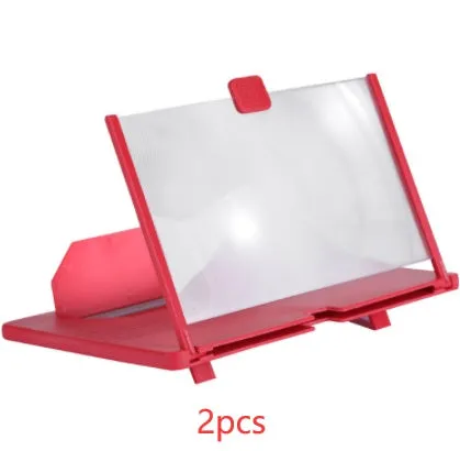 Black plastic mobile phone screen magnifier 12 inch 30cm diagonal on desk