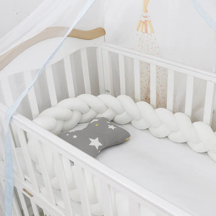 Long, flexible baby crib bumper pillow in spandex velvet, shown fitted around a white cot for safety protection.