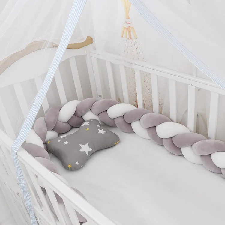 Long, flexible baby crib bumper pillow in spandex velvet, shown fitted around a white cot for safety protection.