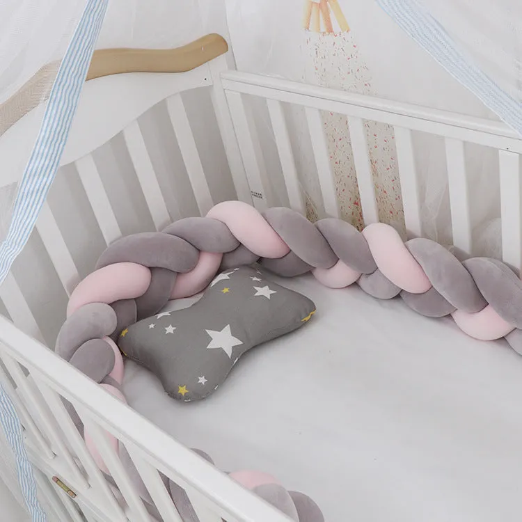 Long, flexible baby crib bumper pillow in spandex velvet, shown fitted around a white cot for safety protection.