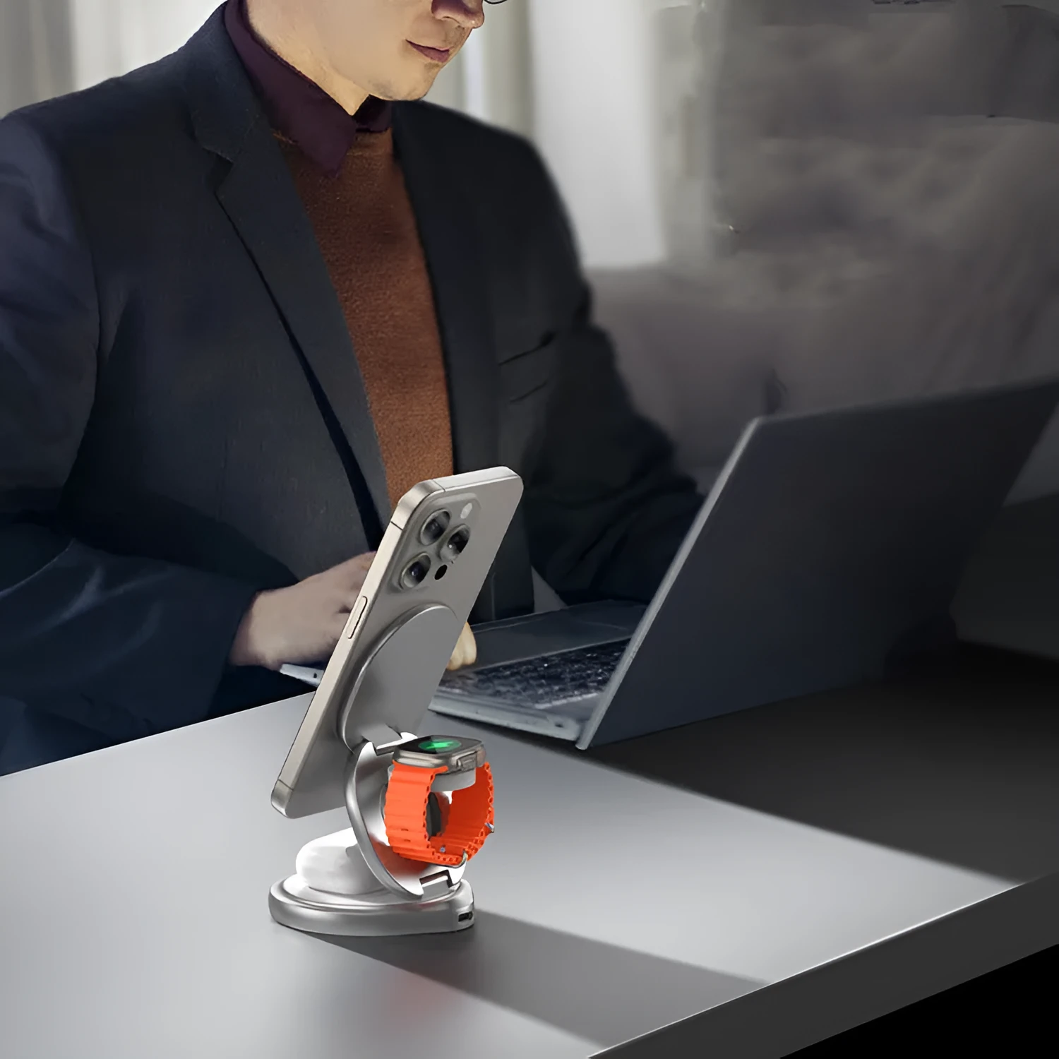 3-in-1 magnetic folding wireless charger stand in grey, with phone and headphones on a desk