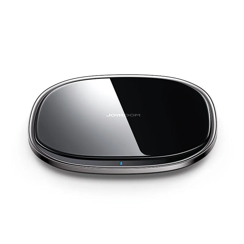 Square black 15W wireless charging pad with glass top and thin zinc alloy frame on a wooden desk