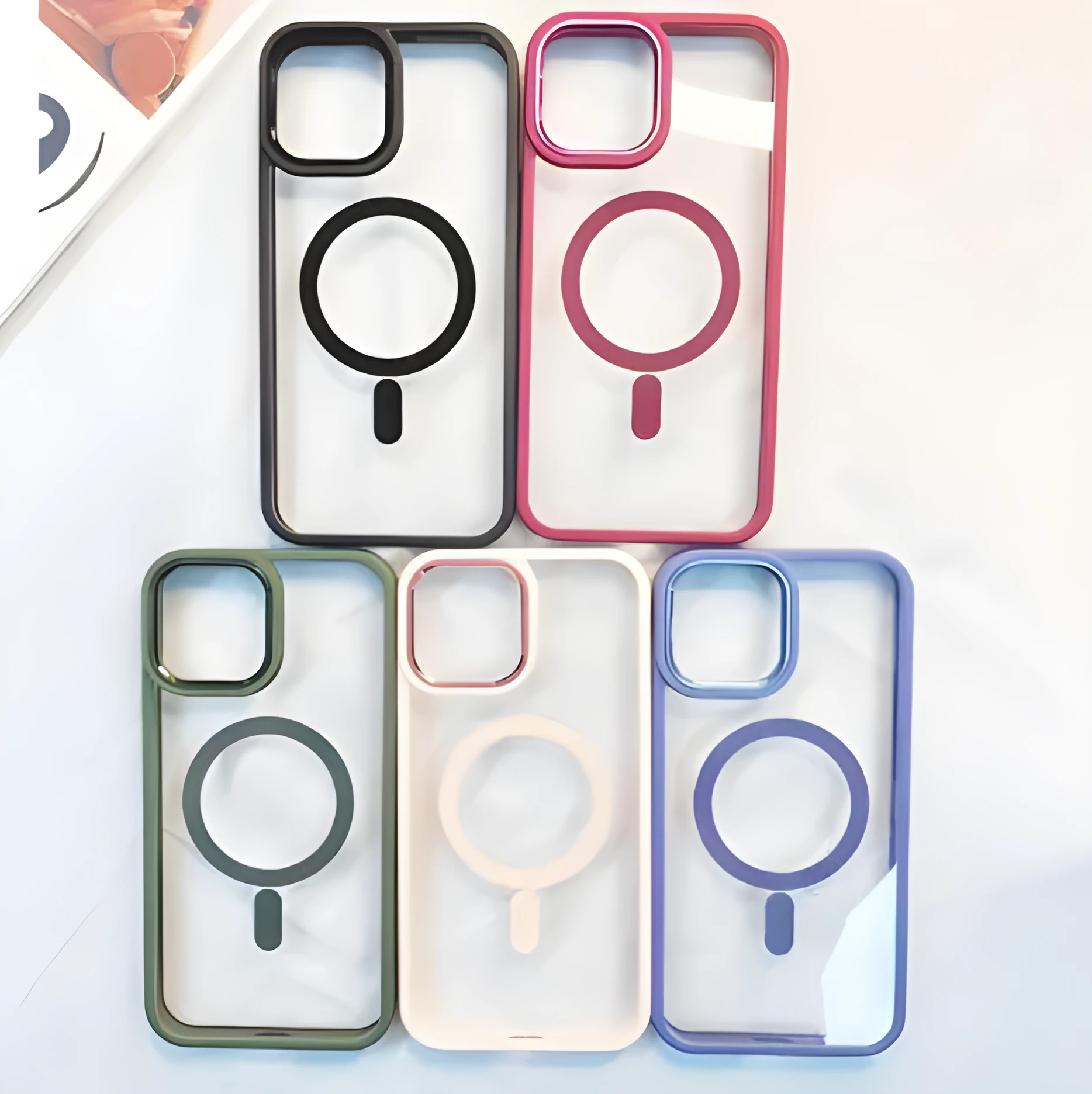 Silicone magnetic phone case for iPhone 15 Pro Max in black, showing transparent back and MagSafe ring