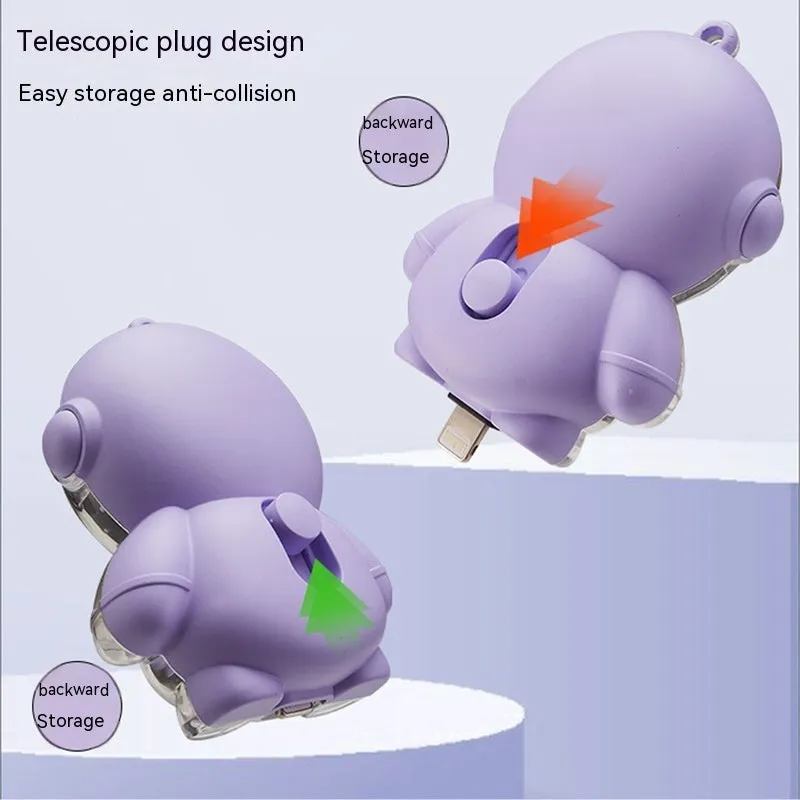 Small keychain emergency power bank in orange plastic shell with cartoon-style design and keyring attachment