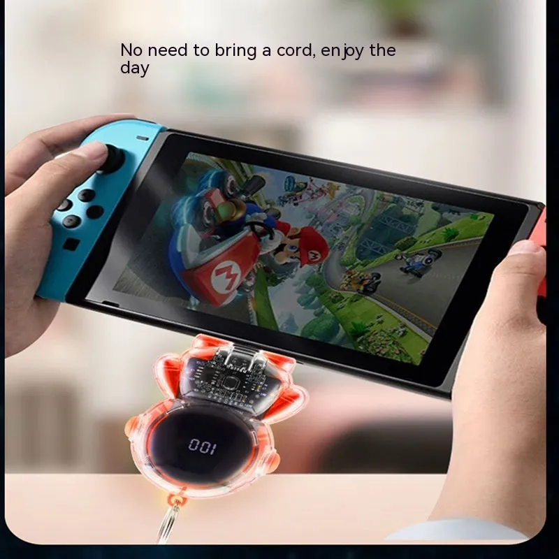 Small keychain emergency power bank in orange plastic shell with cartoon-style design and keyring attachment