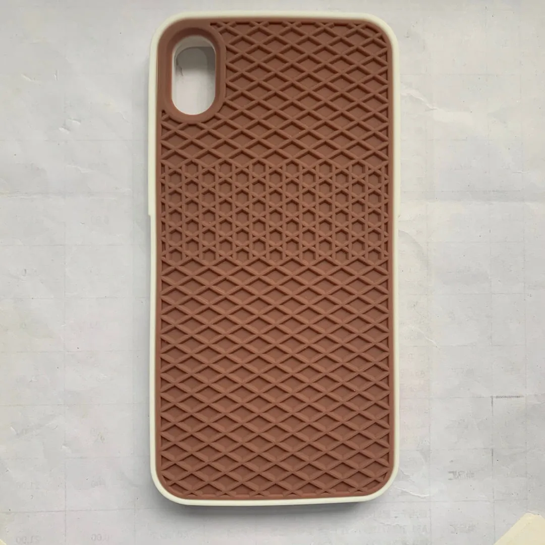 Waffle sole silicone phone case for iPhone 6s with checker pattern texture in black edge on brown background