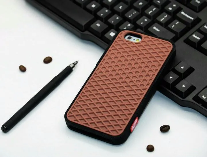 Waffle sole silicone phone case for iPhone 6s with checker pattern texture in black edge on brown background