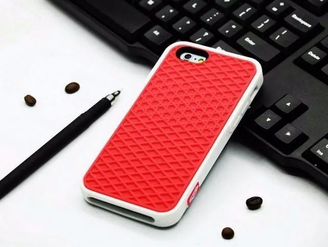 Waffle sole silicone phone case for iPhone 6s with checker pattern texture in black edge on brown background