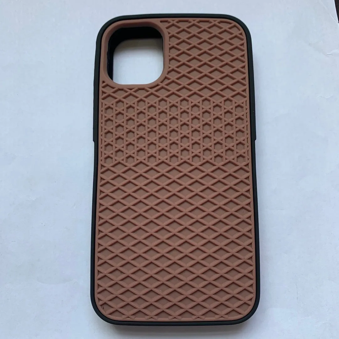 Waffle sole silicone phone case for iPhone 6s with checker pattern texture in black edge on brown background