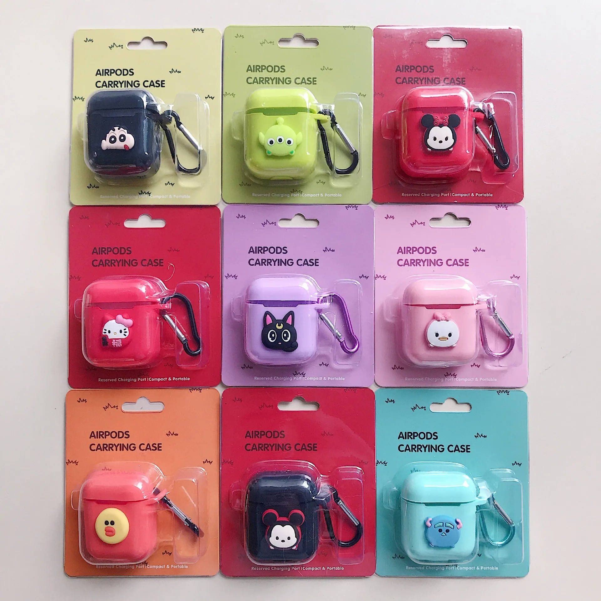 Silicone protective case for Bluetooth earphones with cartoon design and key-clasp hanging rope