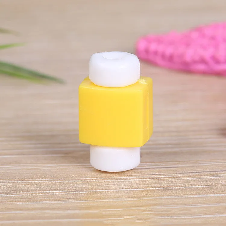 Solid colour plastic data cable protective sleeve for connector joint in yellow