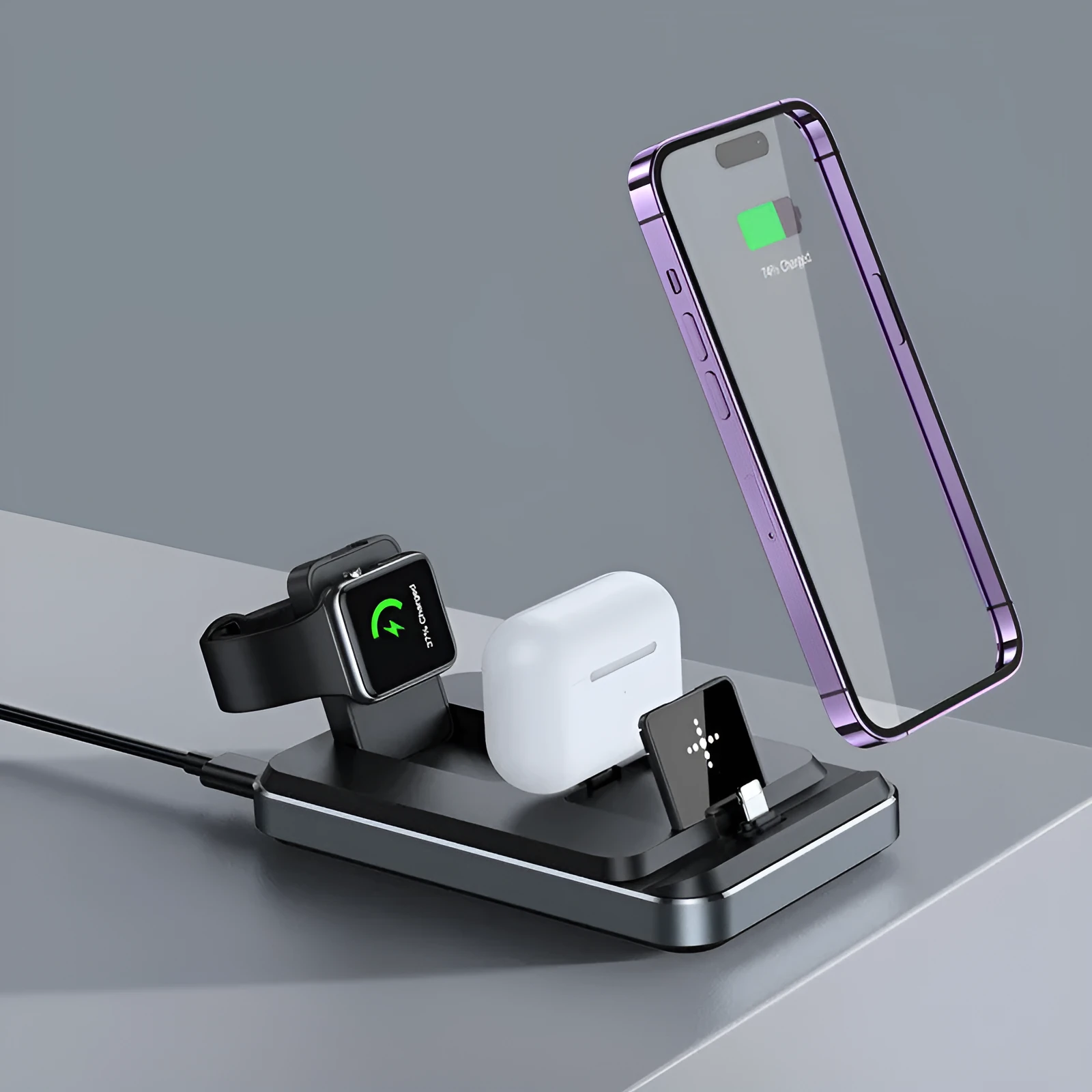 Flat folding three in one wireless charger in black with phone, watch, and headphones placed on charging zones