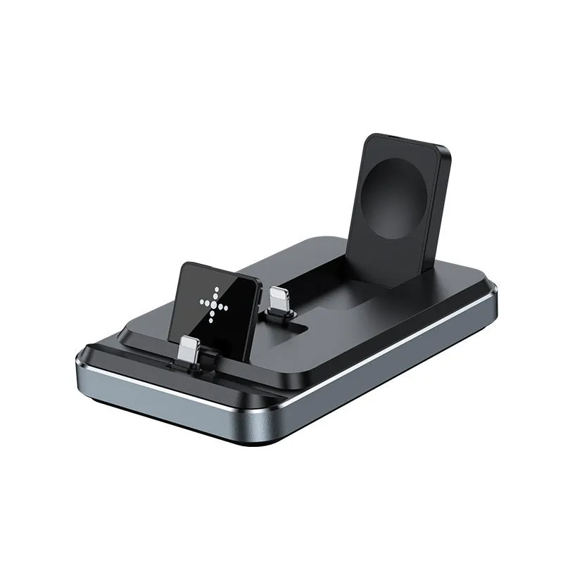 Flat folding three in one wireless charger in black with phone, watch, and headphones placed on charging zones