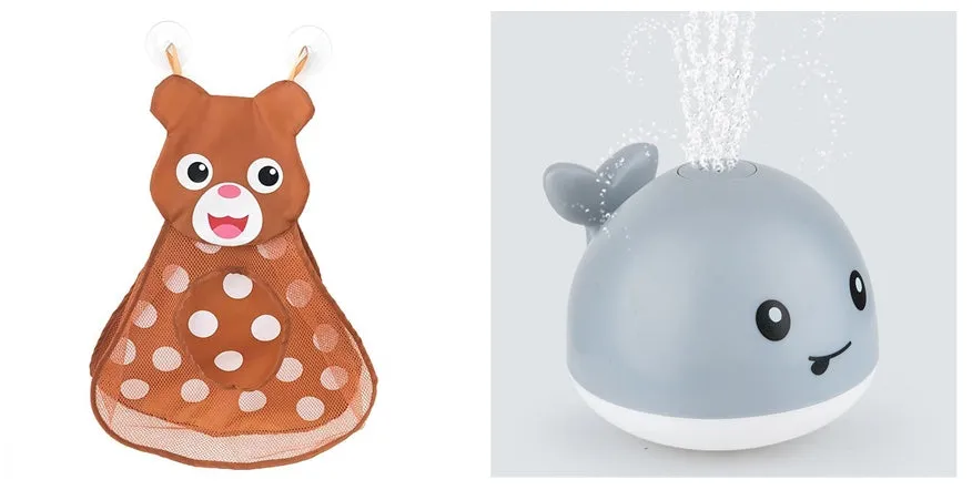 White and blue whale bath toy spraying water with LED lights on, floating in a bathtub