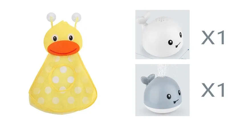 White and blue whale bath toy spraying water with LED lights on, floating in a bathtub