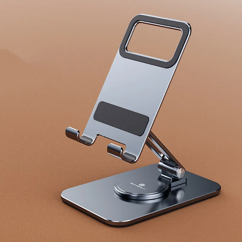 Folding aluminium alloy mobile phone stand in silver on a desktop showing rotary mechanism