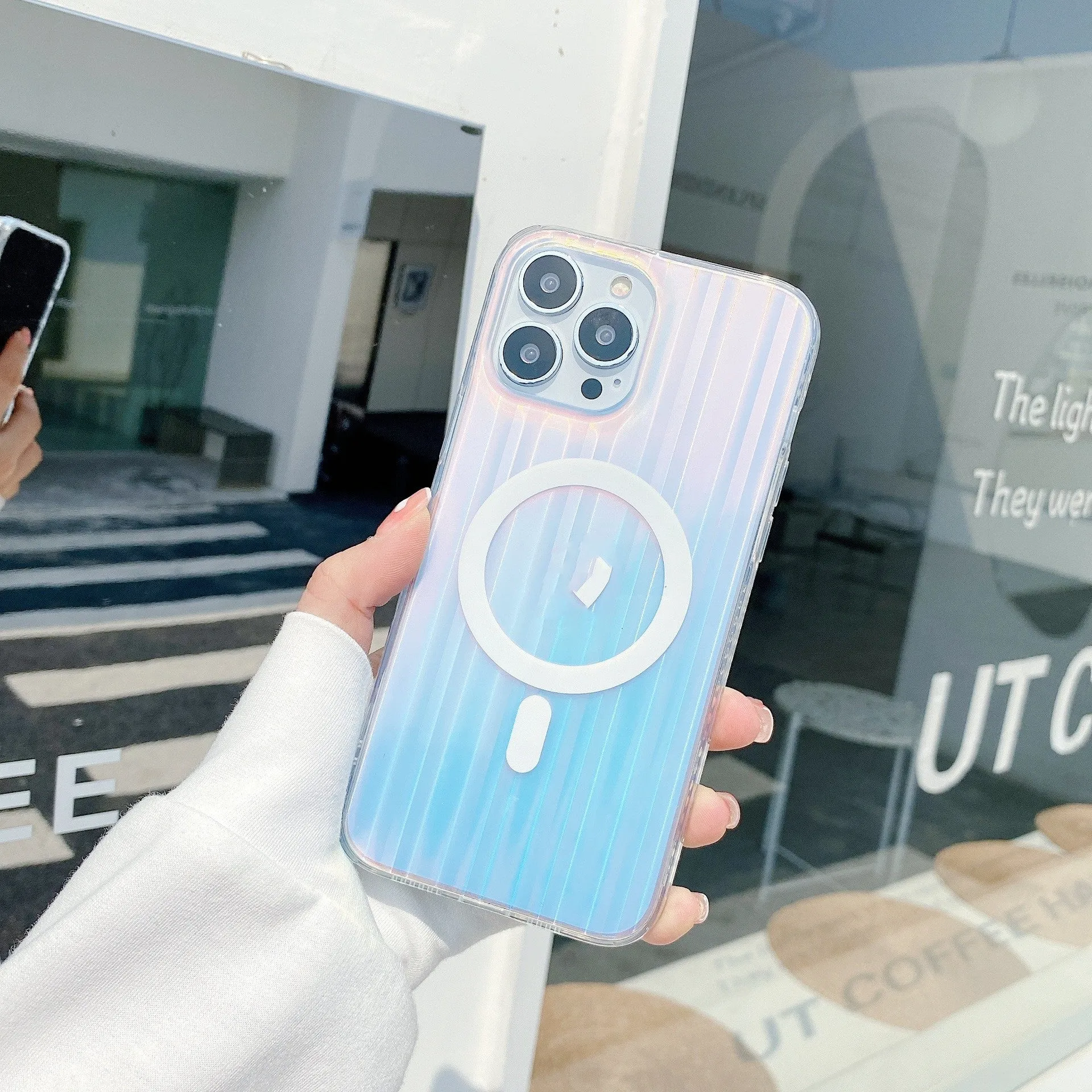 Transparent frosted magnetic back case for iPhone 14 Pro Max with visible camera cutout and shiny laser pattern