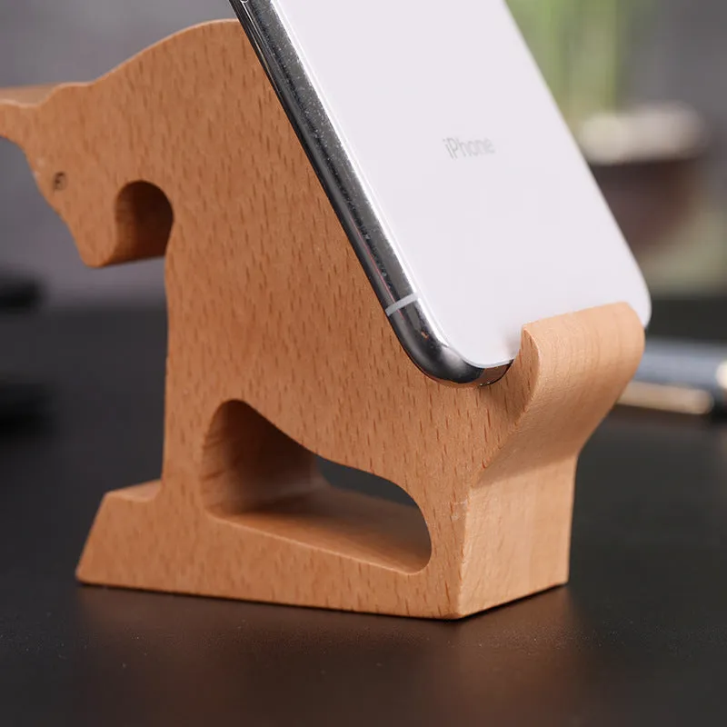 A decorative beech wood and resin mobile phone holder stand featuring themed designs like animals and zodiac signs.