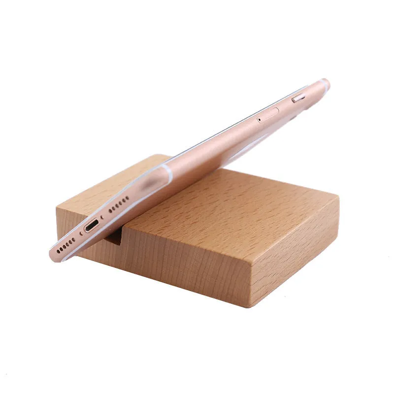 A decorative beech wood and resin mobile phone holder stand featuring themed designs like animals and zodiac signs.