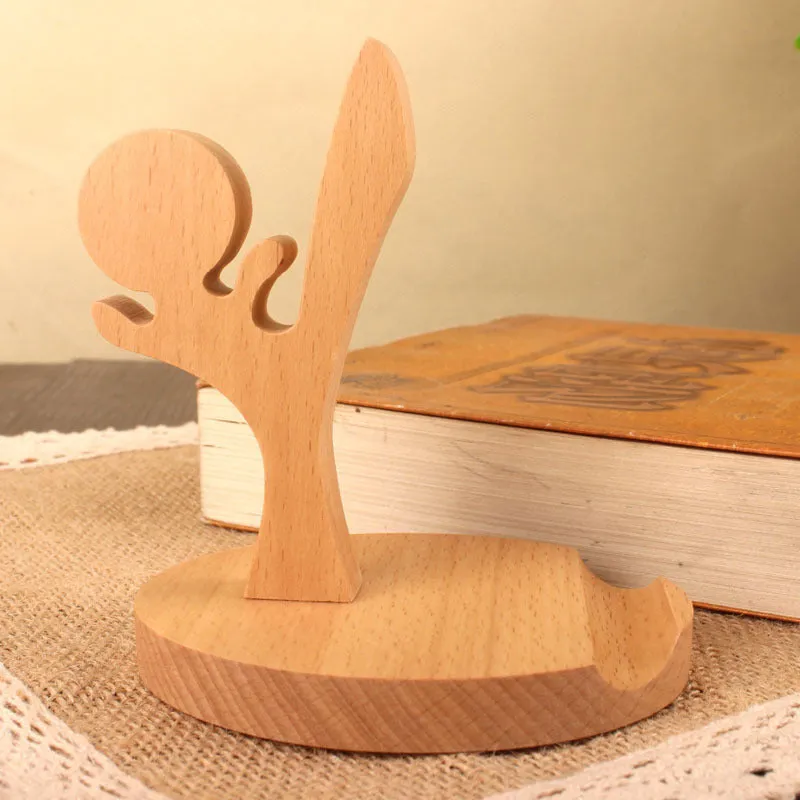 A decorative beech wood and resin mobile phone holder stand featuring themed designs like animals and zodiac signs.