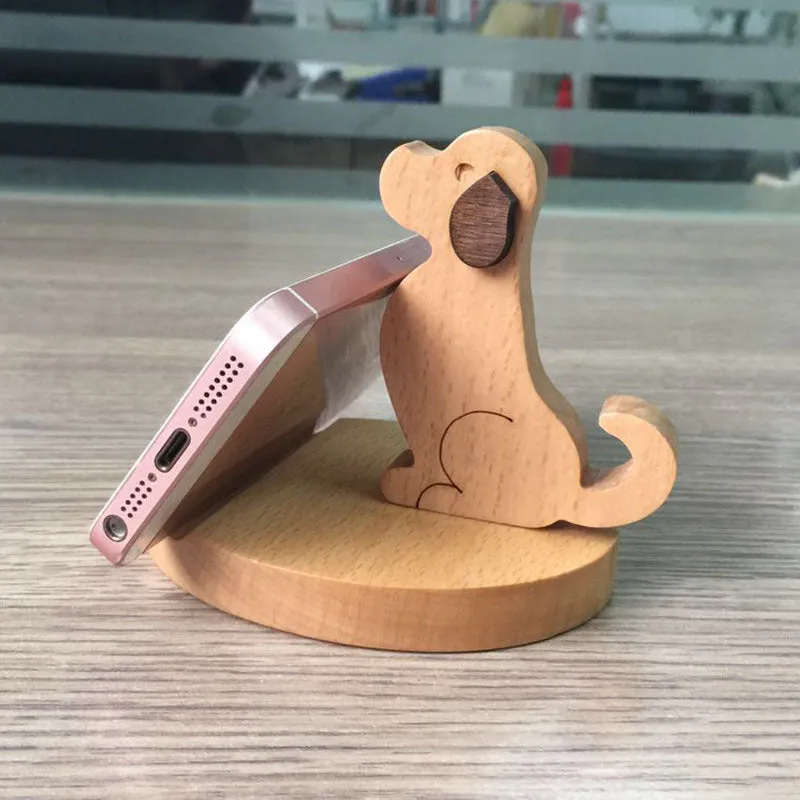 A decorative beech wood and resin mobile phone holder stand featuring themed designs like animals and zodiac signs.
