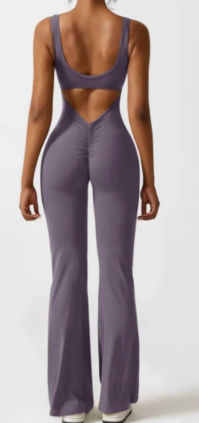 Women's black milk silk yoga bodysuit with seamless design and built-in chest pad on a mannequin.