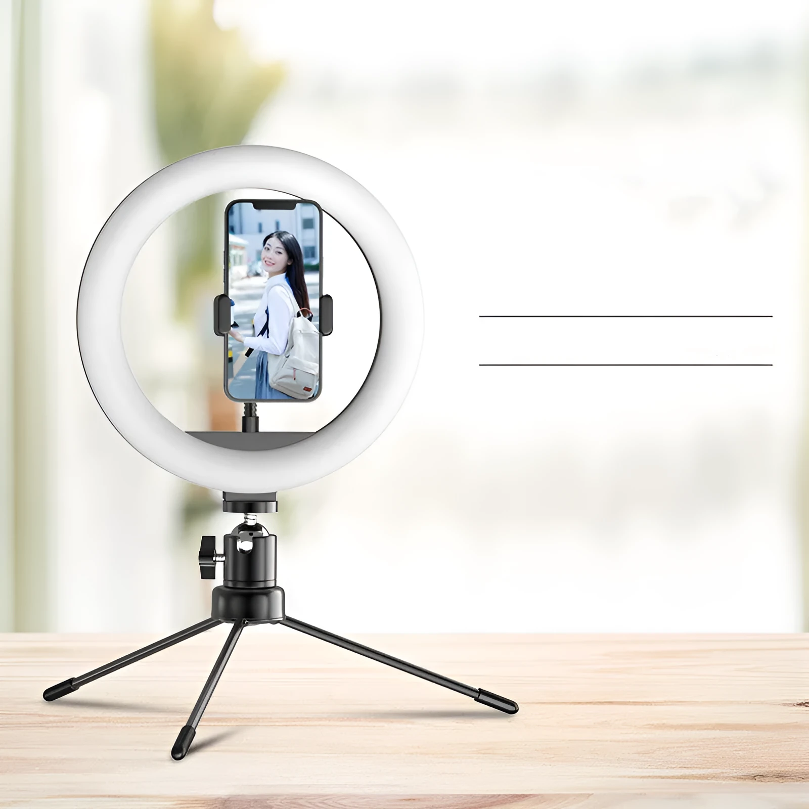10 inch ring fill light desktop tripod stand with Bluetooth remote and phone holder on a table