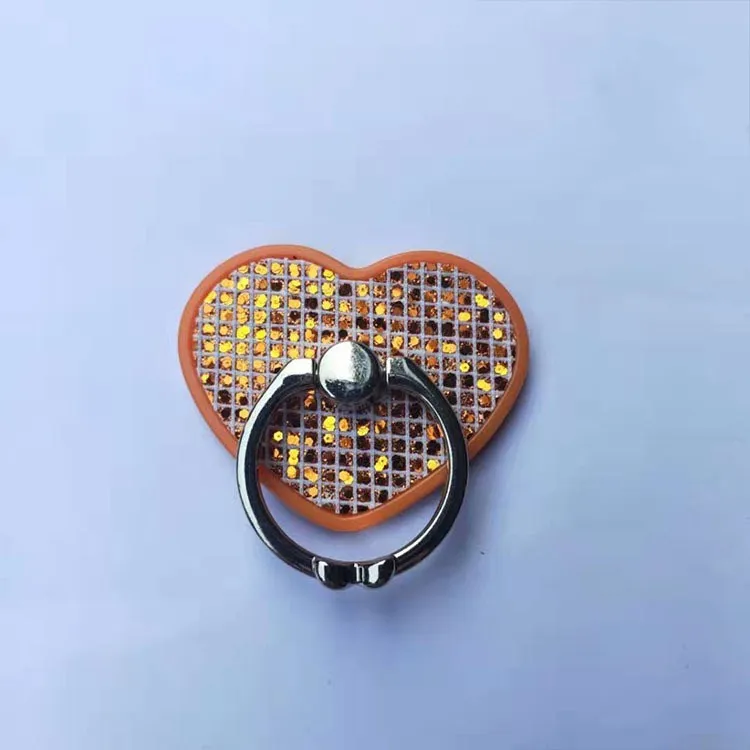 Universal cell phone ring stand with metal and plastic construction, available in five colours including black, gold, and pink