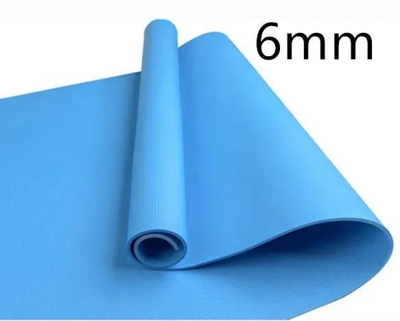 Red EVA fitness yoga mat rolled up next to its storage bag, showing textured surface.