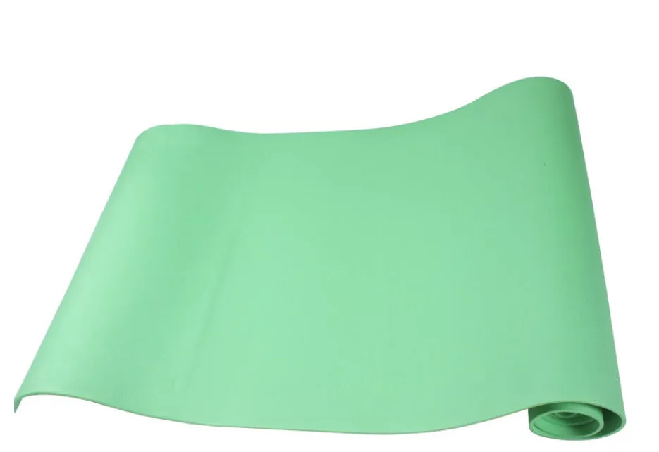 Red EVA fitness yoga mat rolled up next to its storage bag, showing textured surface.