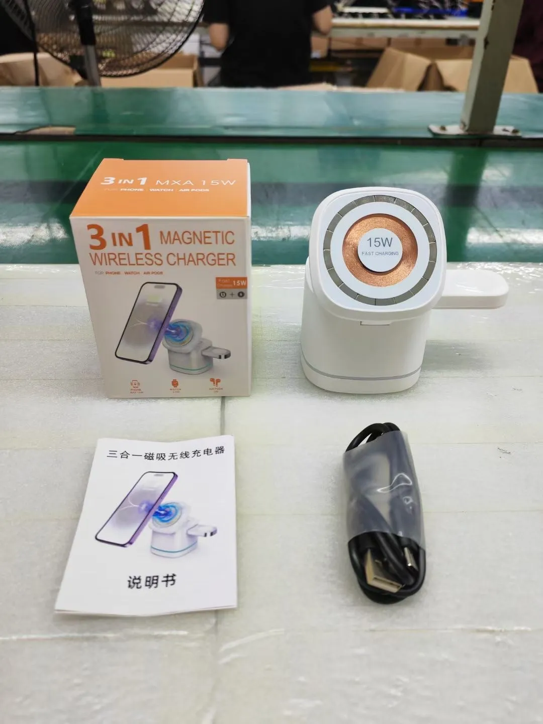 Three-in-one folding magnetic wireless fast charging charger in Iron Grey with phone, earphones and watch placed on charging pads