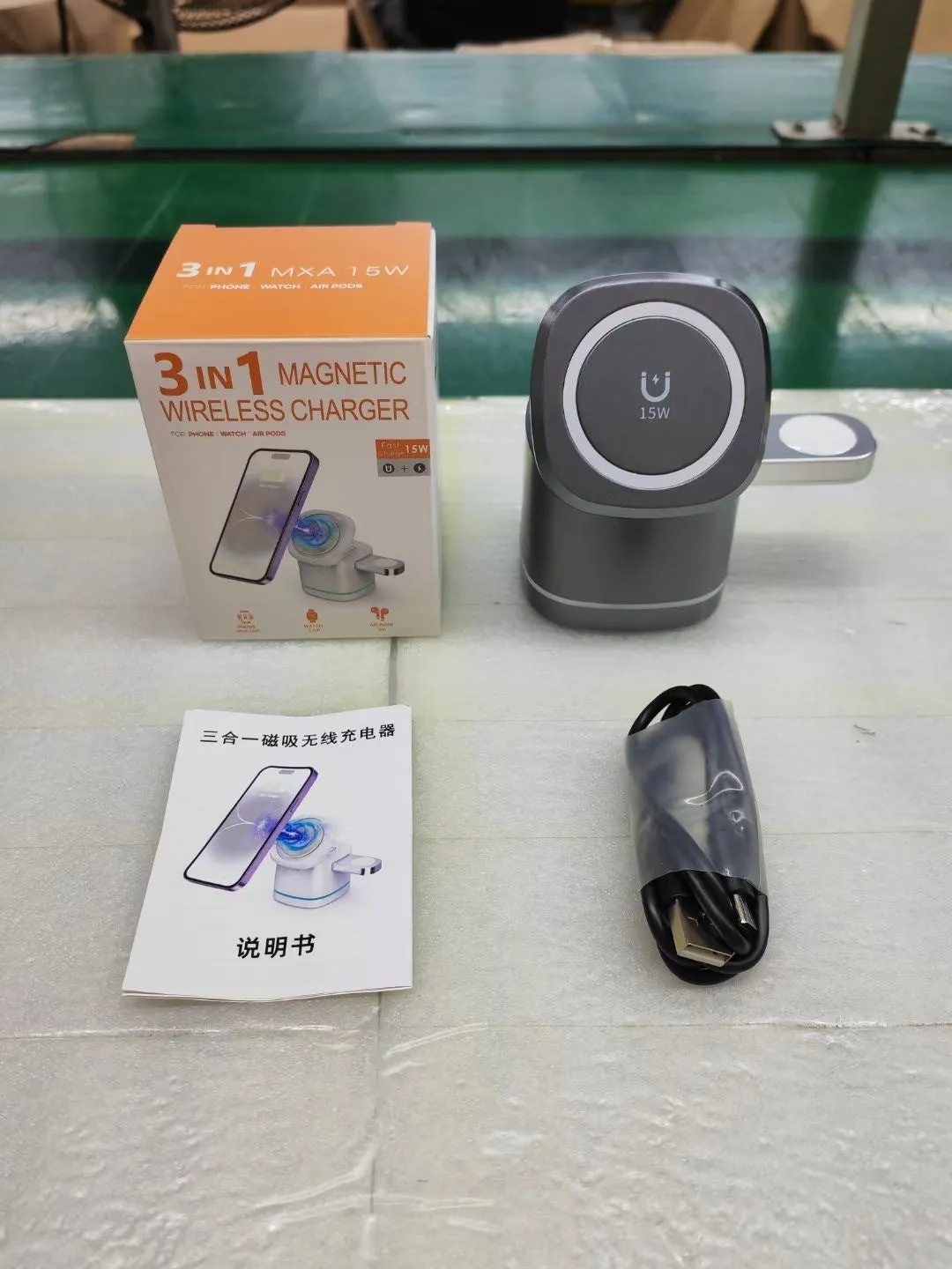 Three-in-one folding magnetic wireless fast charging charger in Iron Grey with phone, earphones and watch placed on charging pads