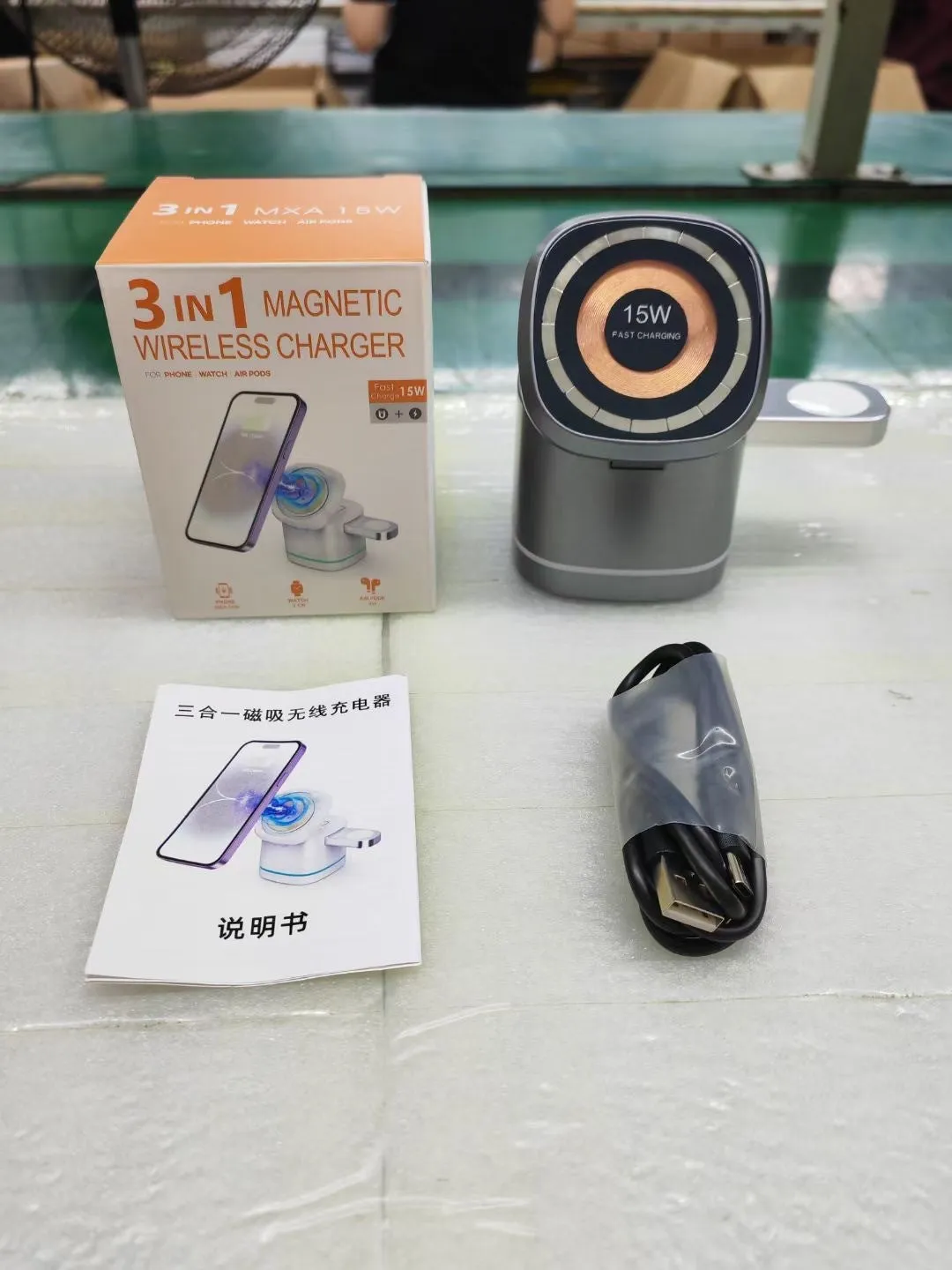 Three-in-one folding magnetic wireless fast charging charger in Iron Grey with phone, earphones and watch placed on charging pads