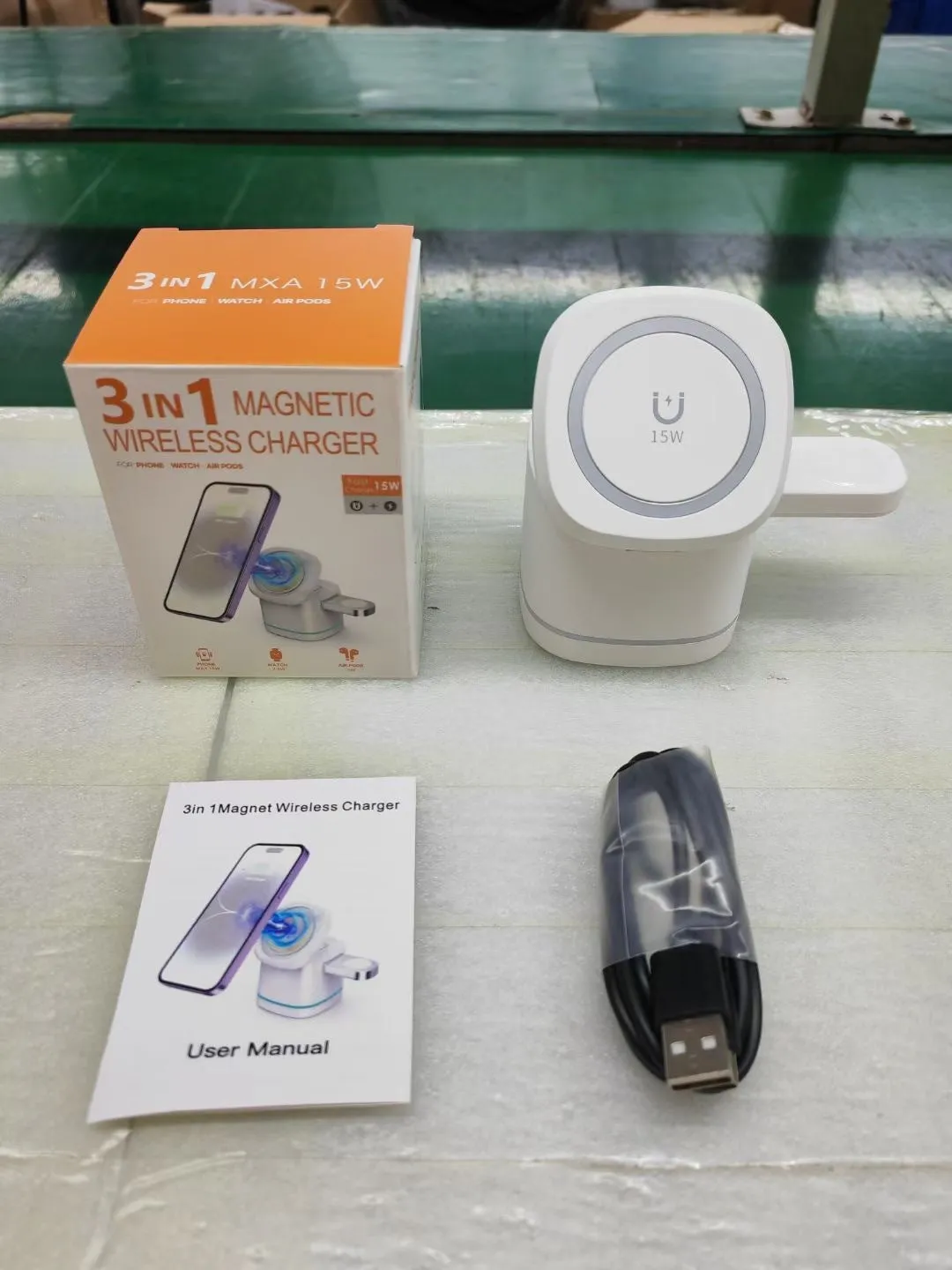 Three-in-one folding magnetic wireless fast charging charger in Iron Grey with phone, earphones and watch placed on charging pads