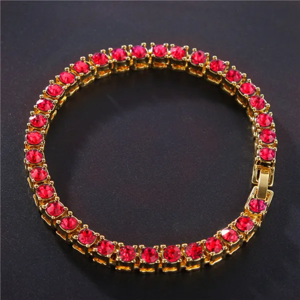 Men's silver geometric chain link bracelet with a row of sparkling clear rhinestones on a black background.