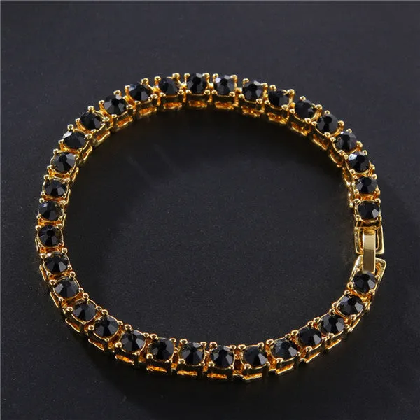 Men's silver geometric chain link bracelet with a row of sparkling clear rhinestones on a black background.