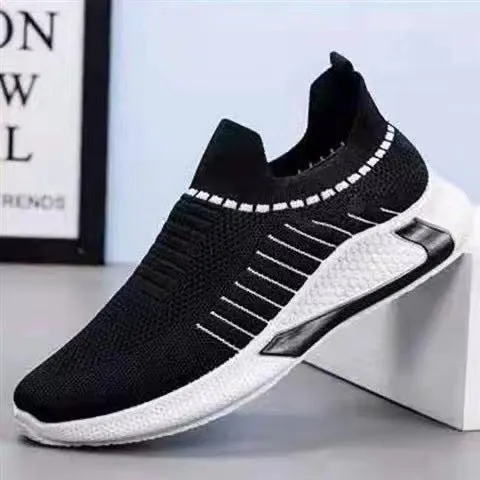 Men's black and white striped mesh slip-on sneakers with flyknit upper and low-cut profile.