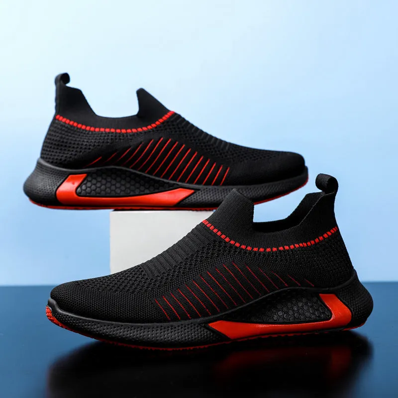 Men's black and white striped mesh slip-on sneakers with flyknit upper and low-cut profile.