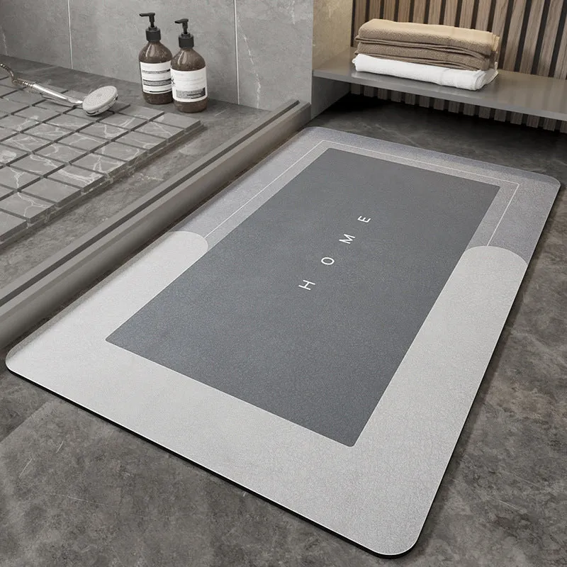 Machine-woven blended bathroom floor mat in blue, shown in an oval shape on a tiled floor.