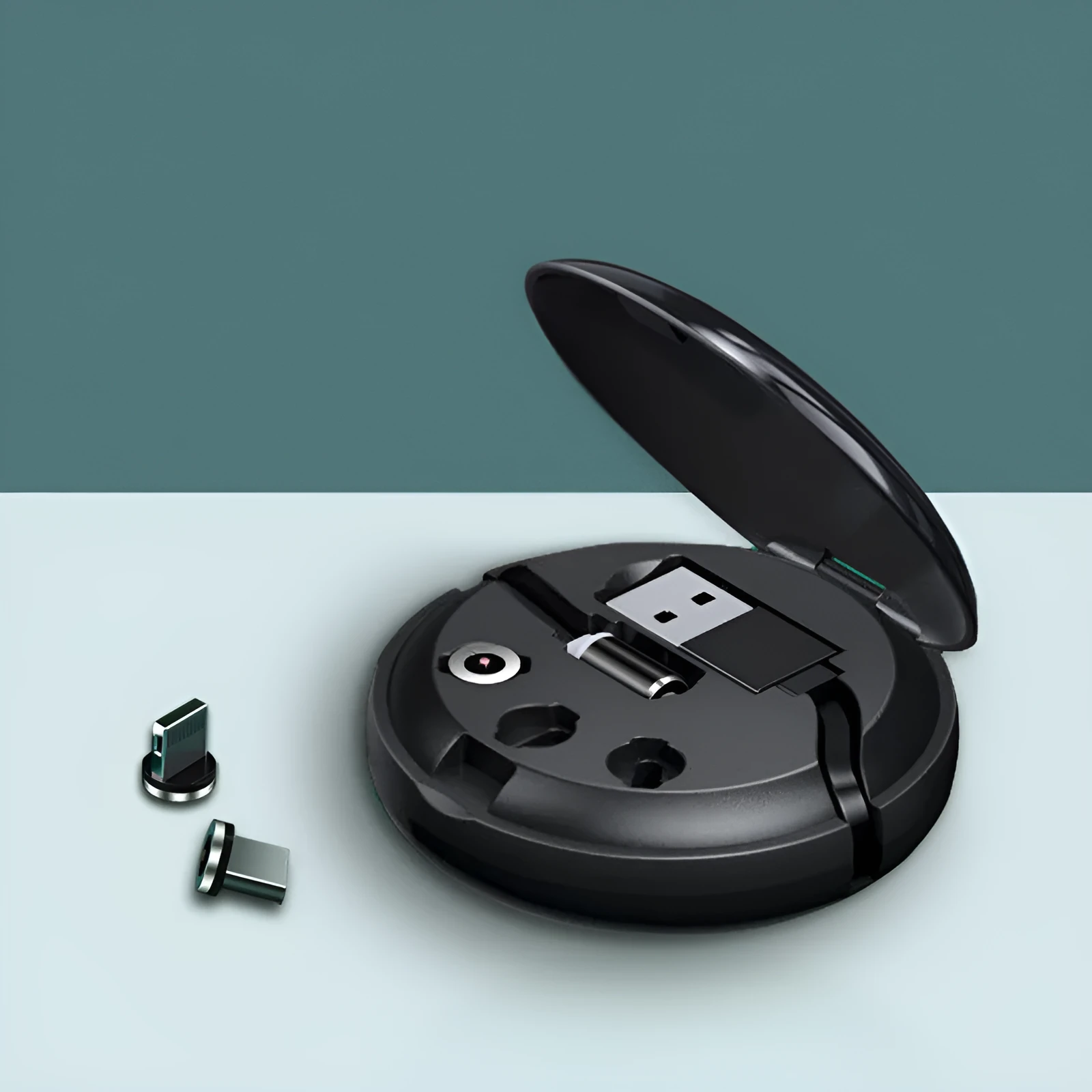 Magnetic Sucker 3-in-1 data cable in black with three connectors on a desk