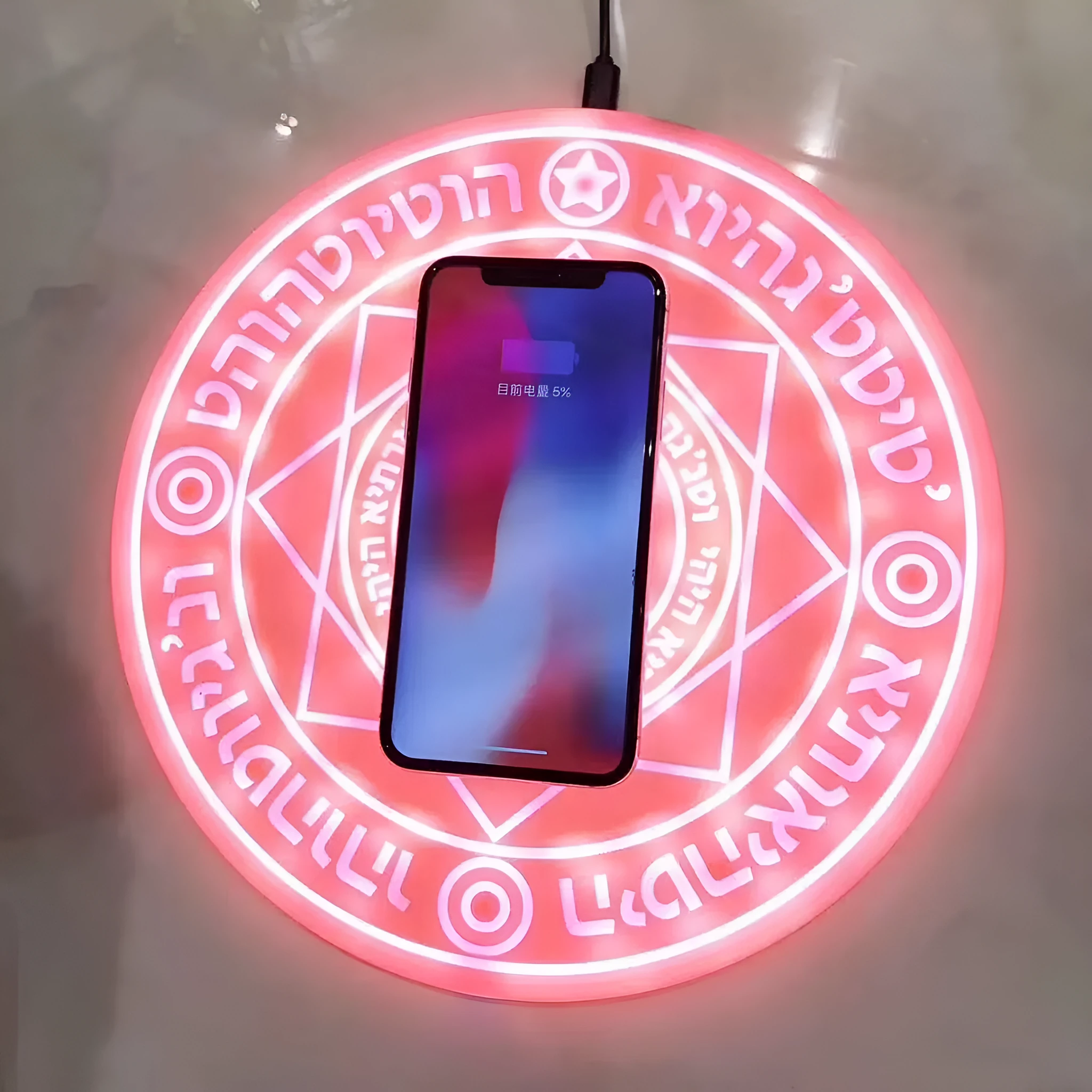 10W fast wireless charger with magic array LED glowing pattern on an ultra-thin black ABS base.