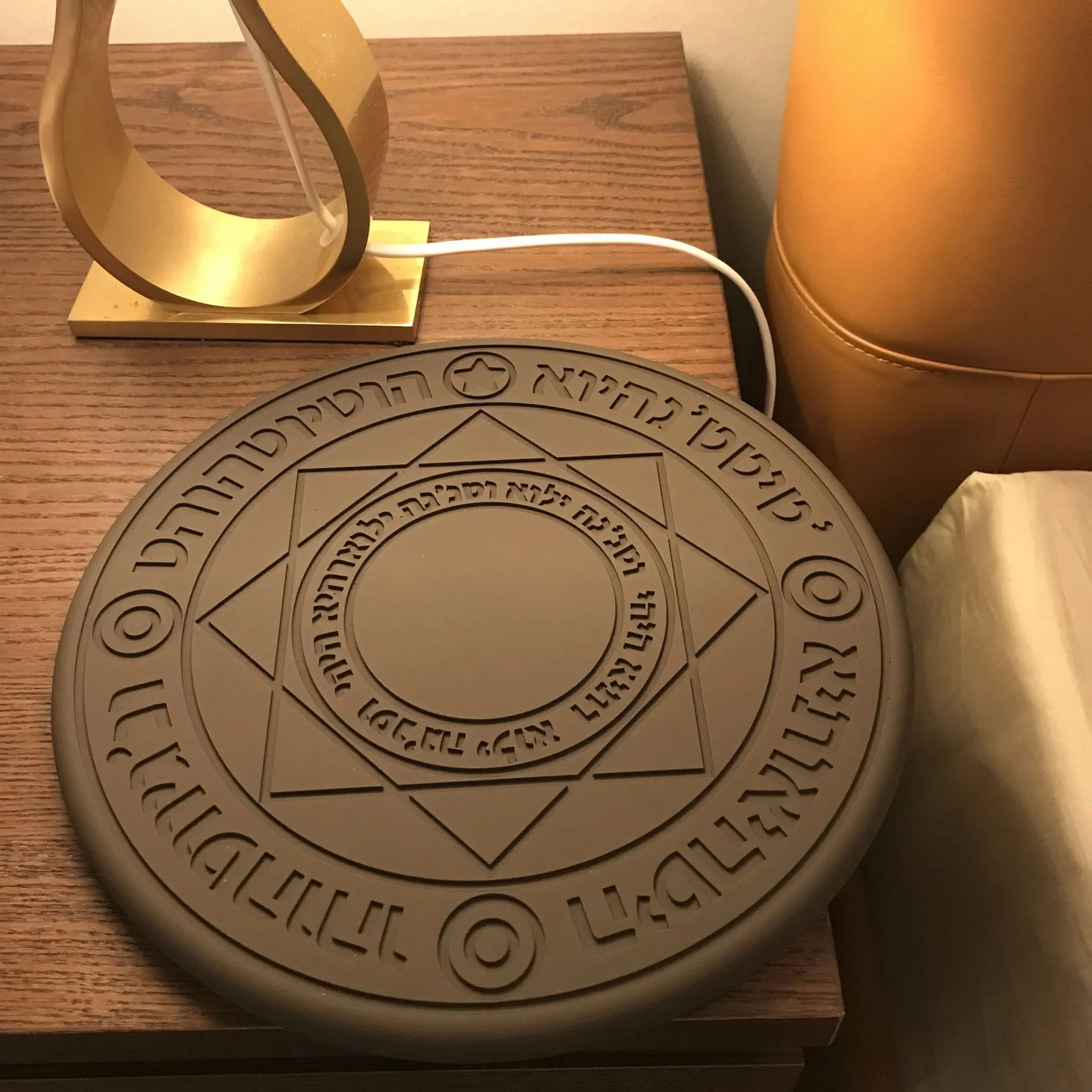 10W fast wireless charger with magic array LED glowing pattern on an ultra-thin black ABS base.