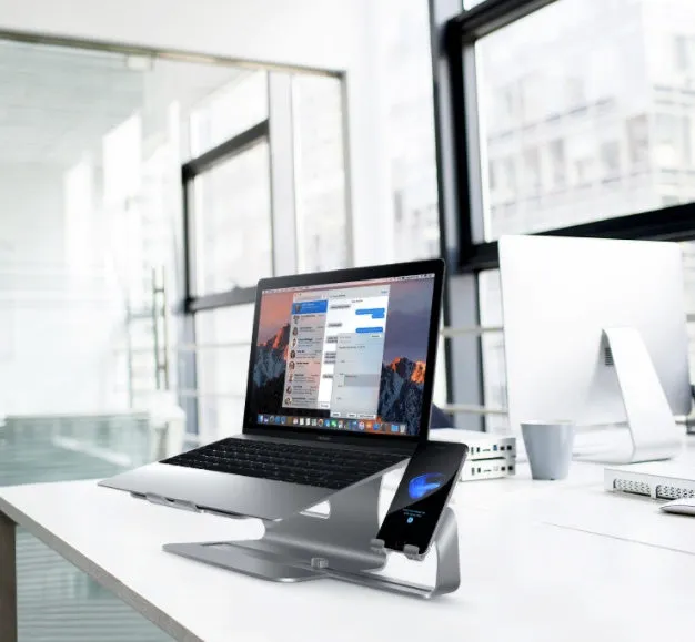 Silver desktop lazy bracket 26x24.3x19cm on a desk holding a tablet